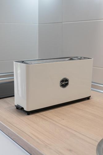 a large white cooler sitting on top of a floor at Cabañas Alcobas do Sil Ecoturismo in Parada del Sil