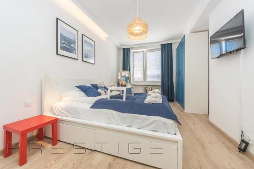 Postel nebo postele na pokoji v ubytování Prestige Apartments Świętojańska