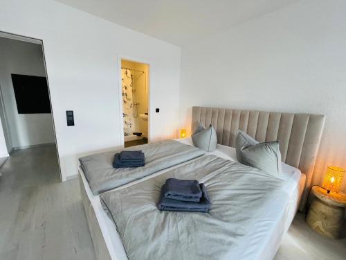 Llit o llits en una habitació de Apartment Strandkorv für 2-4 Personen mit Pool