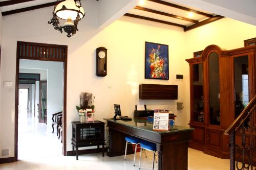 a home office with a desk and a computer at Grand Marto Hotel in Yogyakarta