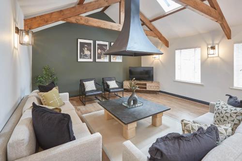 a living room with a couch and a table at Host & Stay - The Annexe @ The Old Brewery in Richmond