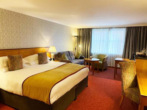 Tempat tidur dalam kamar di Europa Hotel