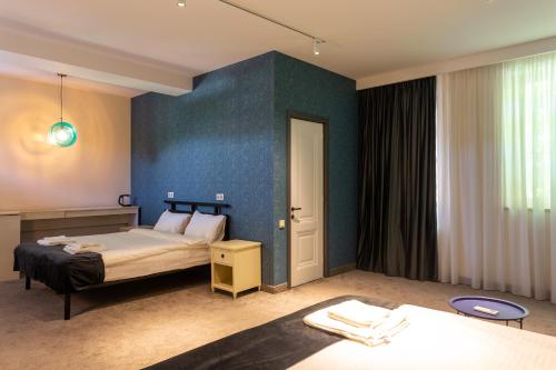Postel nebo postele na pokoji v ubytování Betlemi Hotel