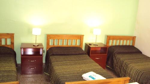 Katil atau katil-katil dalam bilik di Hotel Aries Palermo