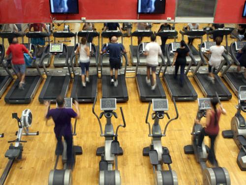 a group of people exercising on treadmills in a gym at BcnSportHostels in Barcelona
