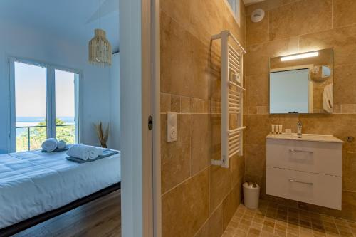 Ванная комната в O'DYSSEE Appartement vue panoramique Bassin d'Arcachon