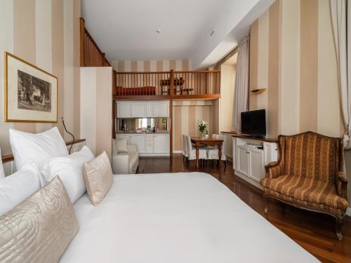 a bedroom with a bed and a living room at Numa Milan Camperio in Milan