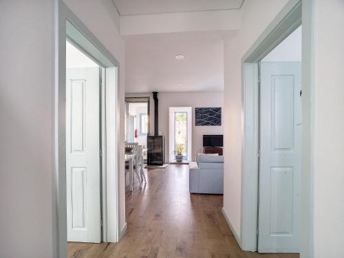 an open door into a room with a living room at Xicotina 2 in Moledo