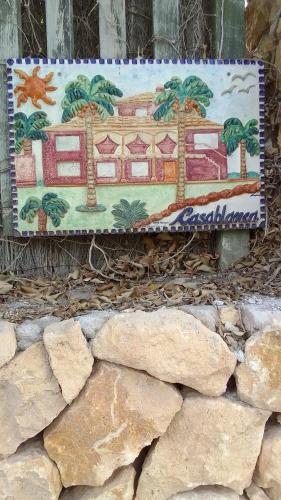a painting of a building with palm trees on a wall at 10 Bedroom 5 Star Luxury Villa & Heated Pool for 5 to 28 Guests near Alicante in Mutxamel