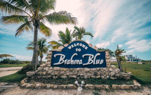 a sign for the bahamas blkarma bar at Brahma Blue Resort in San Pedro