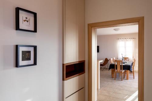a room with a table and a dining room at Seafront Villa Endless View in Blato