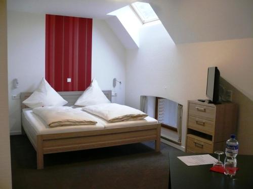 Säng eller sängar i ett rum på Gästehaus Fraune