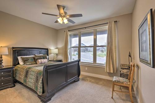 Un dormitorio con una cama con ventilador de techo y una ventana. en 3 Mi to Granby Ranch Home with Hot Tub and Mtn Views!, en Granby