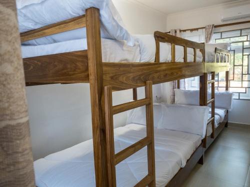 a couple of bunk beds in a room at Mkomazi Hotels and Camps in Hegoma
