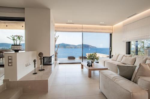 a living room with a view of the ocean at Villa myporos in Poros