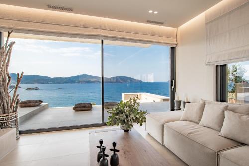 a living room with a view of the ocean at Villa myporos in Poros