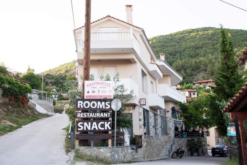 a building with a sign on the side of a street at Agrelia in Agreliá