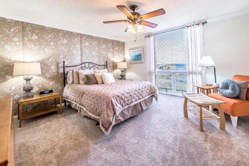 a bedroom with a bed and a ceiling fan at Shoreline Towers 3074 in Destin
