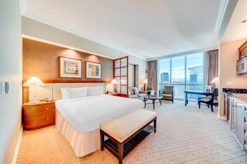 a hotel room with a bed and a desk at Jet Luxury Elite at The Signature in Las Vegas