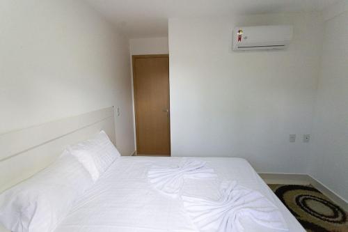 Cama o camas de una habitación en Carpediem - Apartamento com ótima localização em Cabo Branco
