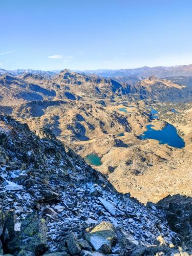 an aerial view of a mountain with two lakes at Hotel Els Encantats in Espot