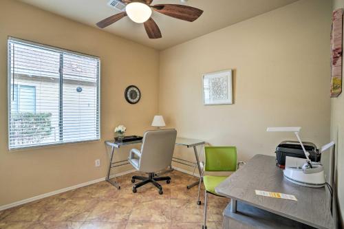 an office with a ceiling fan and a desk and chairs at Luxe Anthem Home with Grilling Patio Near Hiking! in Anthem