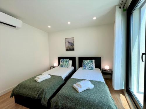 Säng eller sängar i ett rum på Faro Design 6 by Homing