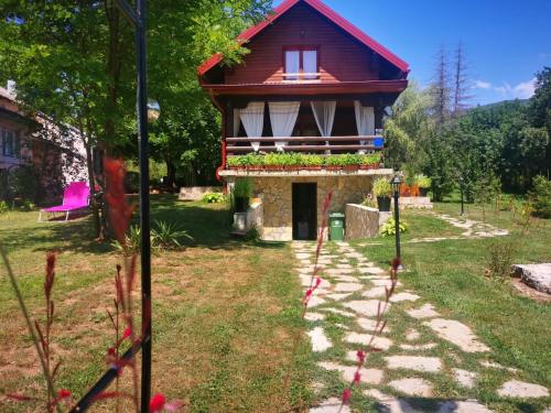 a small house with a red roof at PLITVICE MAGIC in Rudanovac