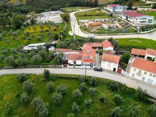 an aerial view of a village with a road and houses at Casa da Avó Fátima in Góis