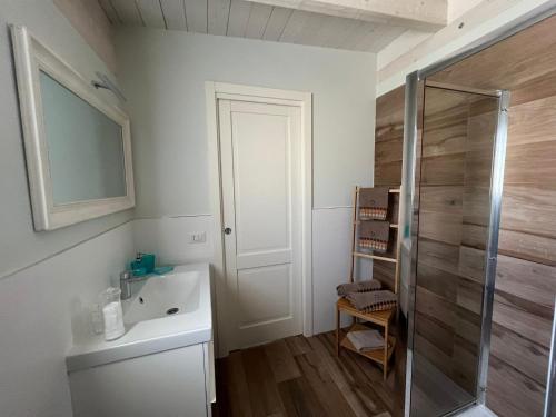 a bathroom with a sink and a shower at La Casa Dei Nonni in Matera