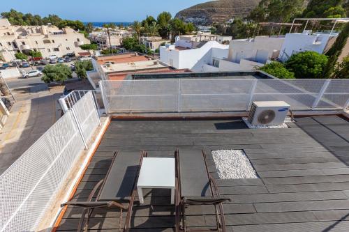 a view from the roof of a building with chairs at La Terraza de Agua Amarga in Agua Amarga