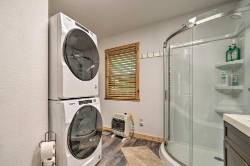 a washing machine in a bathroom with a shower at Waterfront Cottage in Fort Towson with 2 Decks! in Fort Towson