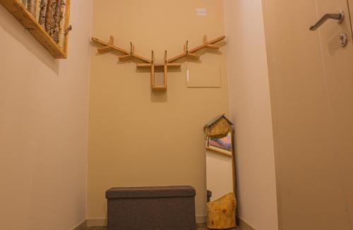 a bathroom with a toilet and a stair case at Ca' di Pazient in Teglio