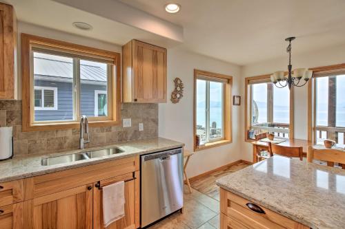 a kitchen with a sink and a counter top at Oceanfront Craig Apt Grill, Fishing On-Site! in Craig
