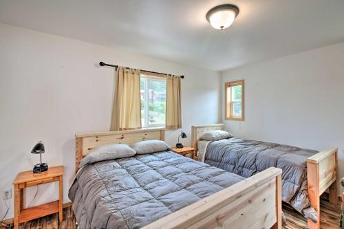 a bedroom with two beds and a window at Oceanfront Craig Apt Grill, Fishing On-Site! in Craig