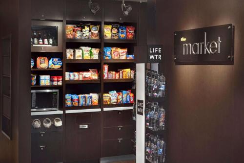 a kitchen with a pantry with food and drinks at Sonesta Select Whippany Hanover in Whippany
