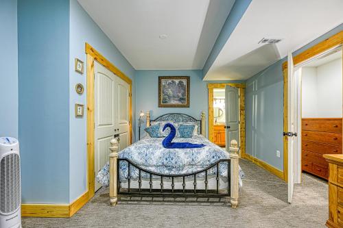 a bedroom with a bed with a blue wall at The Last Cast in Bumpass