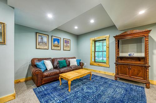 a living room with a brown couch and a table at The Last Cast in Bumpass