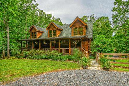 a wooden house with a fence in front of it at The Last Cast in Bumpass