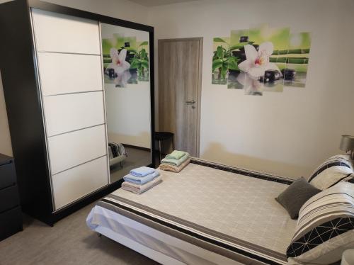 a bedroom with a bed and a mirror at Viktor rooms and apartments in Rovinj