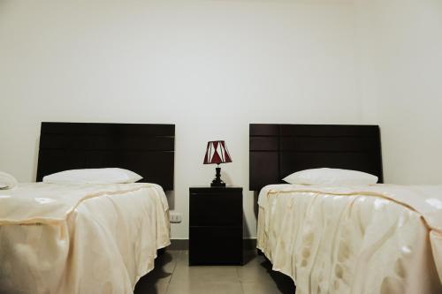 Ένα ή περισσότερα κρεβάτια σε δωμάτιο στο Hospedaje El Velero