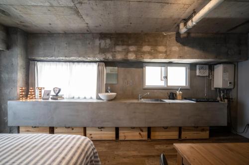 Ένα ή περισσότερα κρεβάτια σε δωμάτιο στο Shibuya Park Residence Yoyogi Park