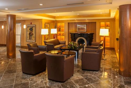 a lobby with couches and chairs and a fireplace at Beechwood Hotel in Worcester