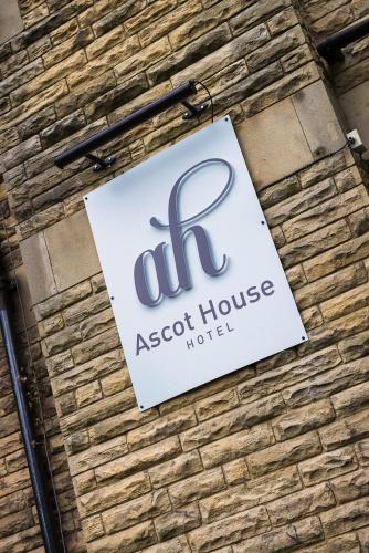 a sign on the side of a brick building at Ascot House in Harrogate