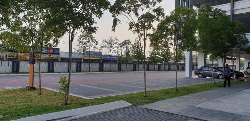 a parking lot with a car parked on a street at BSP21 Family Homestay in Jenjarum