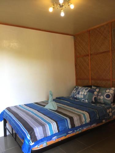 a bedroom with two beds in a room at Hope Inn in Bolod