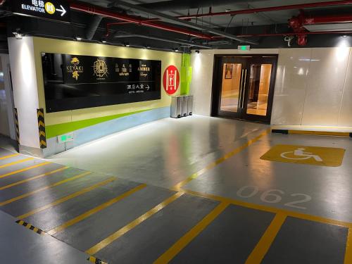 an empty parking garage with a sign on the wall at Pan Pacific Beijing in Beijing
