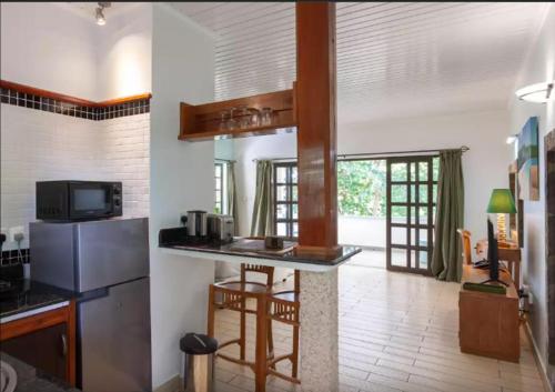 Kuchyň nebo kuchyňský kout v ubytování La Digue Self-Catering Apartments