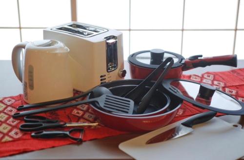 a pile of kitchen utensils on top of a counter at 京町家の宿 三石 in Kyoto