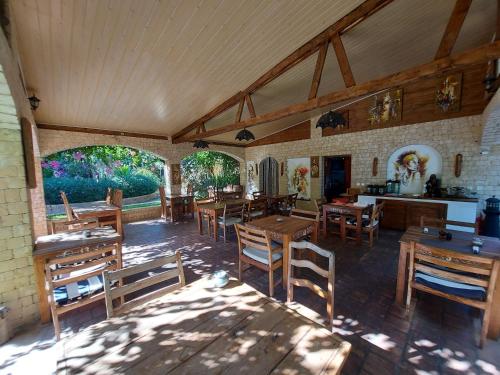 a dining room with wooden tables and chairs at La Bella Donna in Ifaty